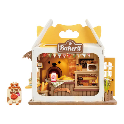Piekarnia Teddy's Breadbox Rolife DS033 – gotowy miniaturowy domek w kształcie żółtego pudełka z niedźwiedziem, widok frontalny z wymiarami 16x4,6x14,5 cm