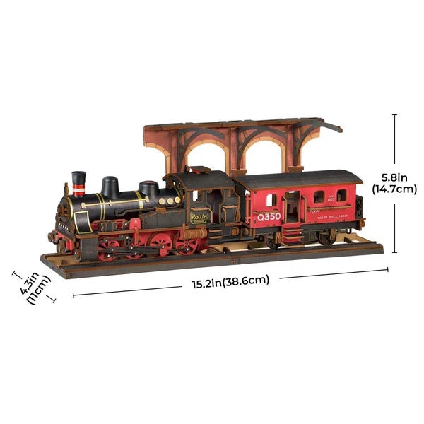 Parowóz Steam Journey Rolife TGS01 – składanie modelu: ręka umieszczająca wagon na drewnianych panelach podstawy