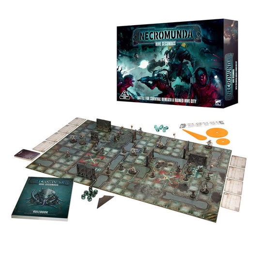 Hive Secundus - pudełko Necromunda i rozłożona zawartość mata do gry z figurkami i terenem podręcznik Rulebook karty żetony i pomarańczowe szablony ognia Necromunda Games Workshop