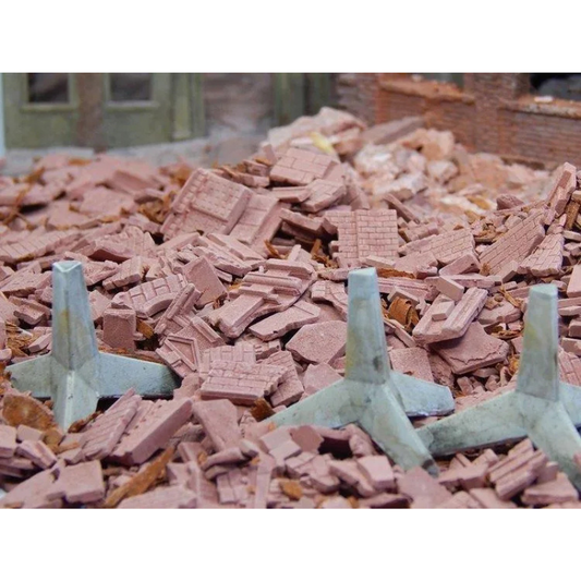 Juweela zapory przeciwczołgowe jeż 1:48 - 3 jeże na gruzowisku z cegłami i zniszczonymi budynkami w tle widok z przodu diorama WWII
