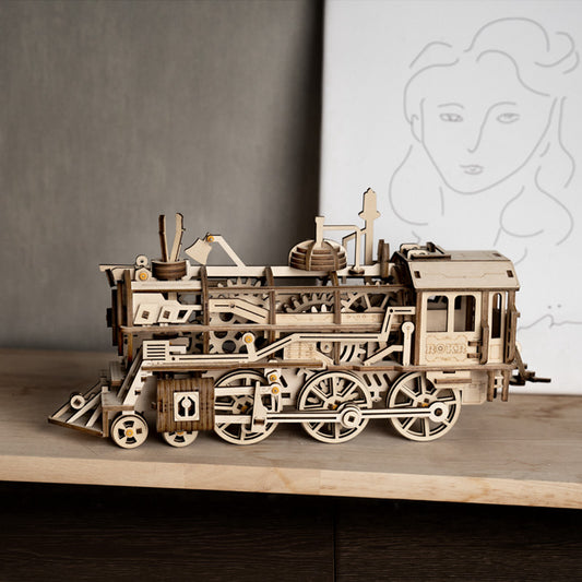 Lokomotywa Parowa ROKR LK701 – pudełko zestawu Locomotive Mechanical Gears: przód z ilustracją modelu, poziom ekspert i oznaczeniem Spring