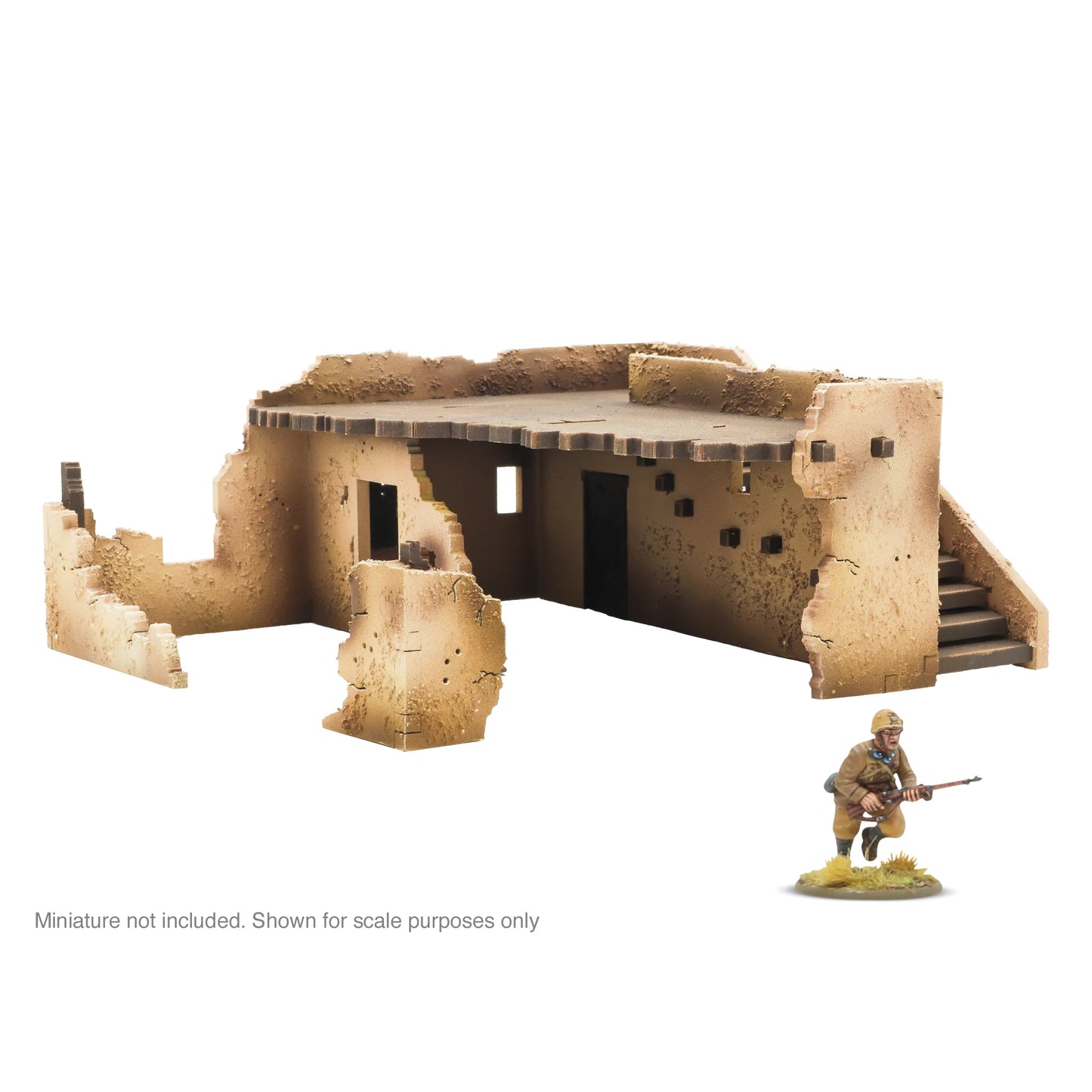 Warlord Games Adobe Building SLC0035 – zniszczony budynek adobe z widoczną częścią schodów, wnętrze parteru i figurka żołnierza, teren do Bolt Action
