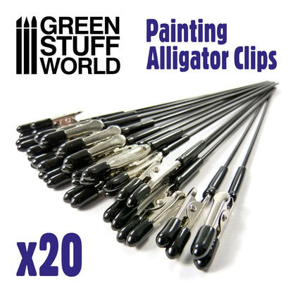 Alligator Clips Green Stuff World – 20 metalowych krokodylków malarskich z czarnymi silikonowymi końcówkami rozłożonych wachlarzowo, napis "Painting Alligator Clips x20", logo GSW
