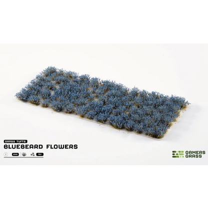Bluebeard Flowers 6mm Gamers Grass - arkusz kępek kwiatowych na białym tle z logo Gamers Grass i opisem produktu: Grass Tufts 6mm 75x
