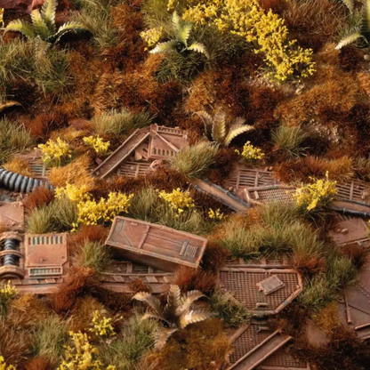 Broom Flowers 6mm Gamers Grass - diorama post-apokaliptyczna z wrakami maszyn pokrytymi żółtymi kępkami janowca i brunatną trawą
