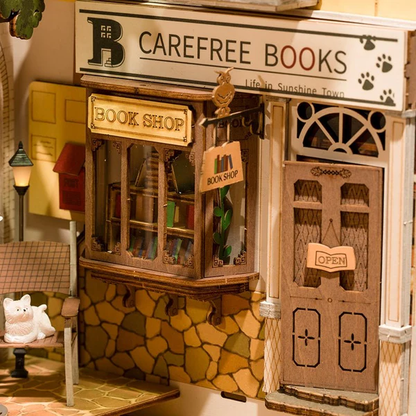 Słoneczne Miasto RDS007e - zbliżenie fasady Carefree Books Life in Sunshine Town szyld Book Shop kot - Värvikas
