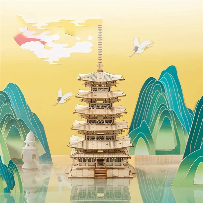 Drewniany puzzle 3D Pięciopiętrowa Pagoda Rolife RK013e – ukończony model na tle japońskiego pejzażu z górami, żurawiami i złotym niebem
