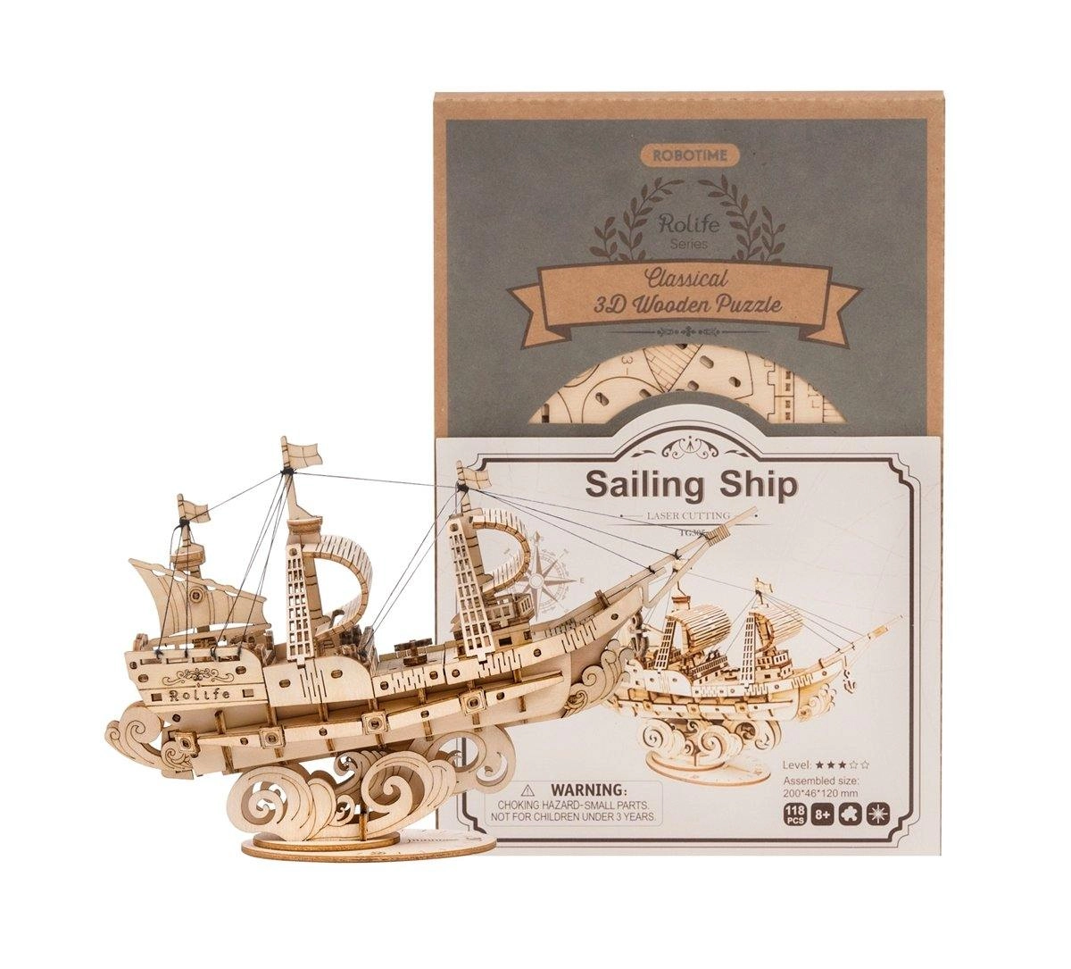 Drewniany puzzle 3D Żaglowiec Rolife RA005e – ukończony model obok pudełka Rolife Classical 3D Wooden Puzzle Sailing Ship TG305 na białym tle
