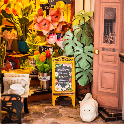 Kwiaciarnia RDS015e - zbliżenie wejścia Floral Corner tulipany lilie monstera szyld Good News 10% off kot - Värvikas
