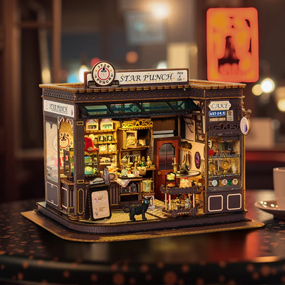 Star Punch K-1083 - Miniaturowy Domek DIY widok frontalny szyld Star Punch czarny kot witrynka Potion & Cake ciepłe LED - Värvikas
