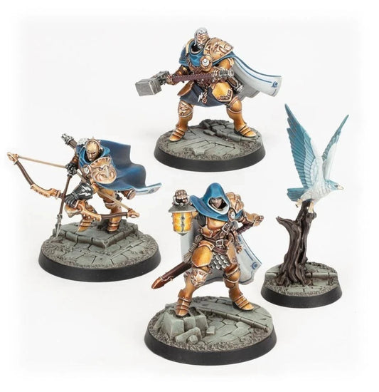 Xandire's Truthseekers - 4 modele Stormcast Eternals w złoto-brązowej zbroi Thunderstrike z niebieskimi płaszczami: łucznik z tarczą, wojownik z młotem, zwiadowczyni z latarnią i mieczem, biały aetherwing na drzewie - Warhammer Underworlds