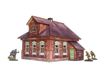 Ostfront Village Forester's Dacha – widok narożnika z zielonymi drzwiami i pięcioma oknami z ozdobnymi framugami, żołnierze po bokach, 28mm Bolt Action
