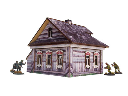 Ostfront Village Whitewashed Dacha – widok izometryczny na narożnik z pięcioma oknami i czerwonymi drzwiami, żołnierze po bokach, 28mm Bolt Action
