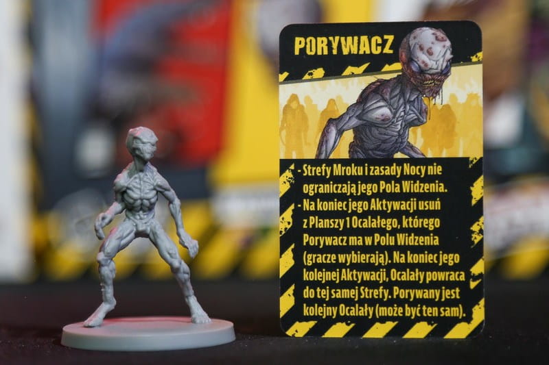 Zombicide Miejskie Legendy – figurka i karta Porywacza: ignoruje Strefy Mroku i porywa Ocalałych
